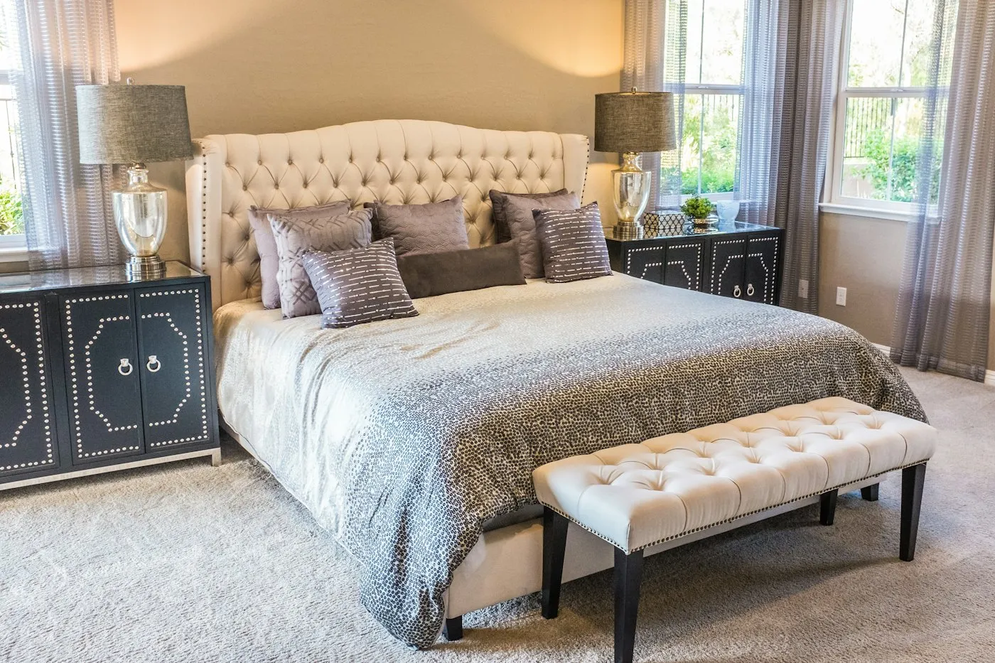 Main bedroom with upholstered bedhead and soft linen